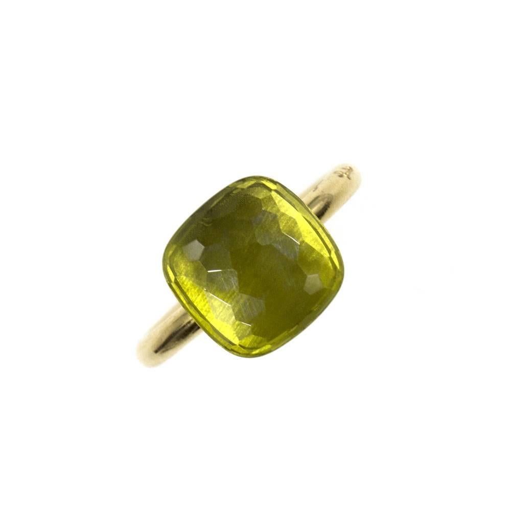 Fabulous designer ring by Pomellato. The stylish ring features a cushion shaped faceted lemon quartz gemstone that measures 11.5 x11.5mm and is set in 18 karat yellow gold. The ring sits up 10mm off the finger and is currently size 6.5 (can be