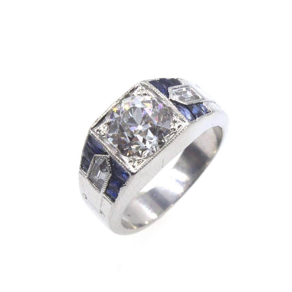 Original Art Deco diamond ring fashioned in platinum. The center 2.17 carat Old European Cut diamond is graded I color and SI2 clarity. The diamond has not been removed from the ring to send for certification. The mounting features sapphire and