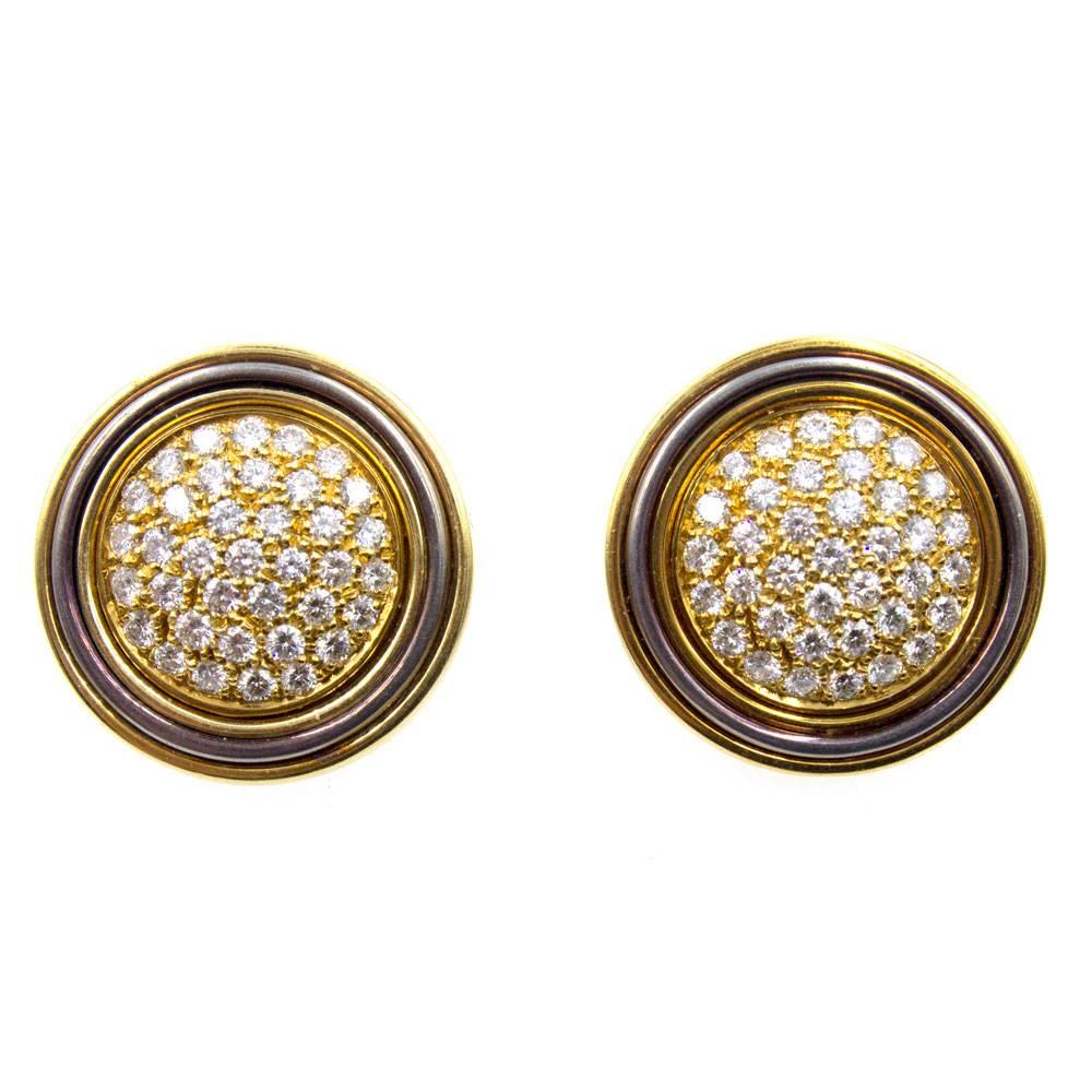 Beautifully crafted Italian pave set diamond earrings circa 1970's. These clip earrings feature 74 round brilliant cut diamonds graded F-G color and VS clarity and equaling approximately 3.00 carat total weight. Fashioned in yellow and oxidized
