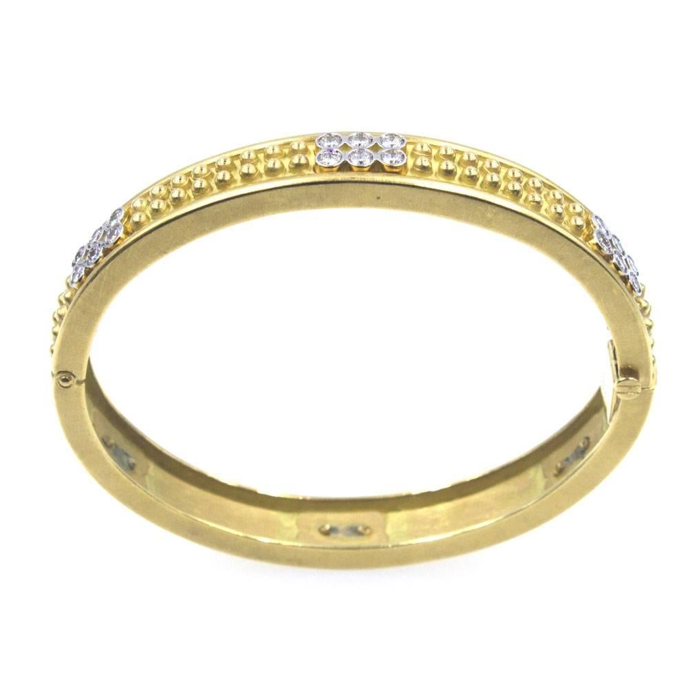 Luxurious Diamond 18 Karat Yellow Gold Studded Bangle Bracelet designed by Forley Jewelers.  The bangle features 36 diamonds and a textured stud design. There are approximately 2.50 carat total weight graded F-G color and VS clarity. Signed 18k