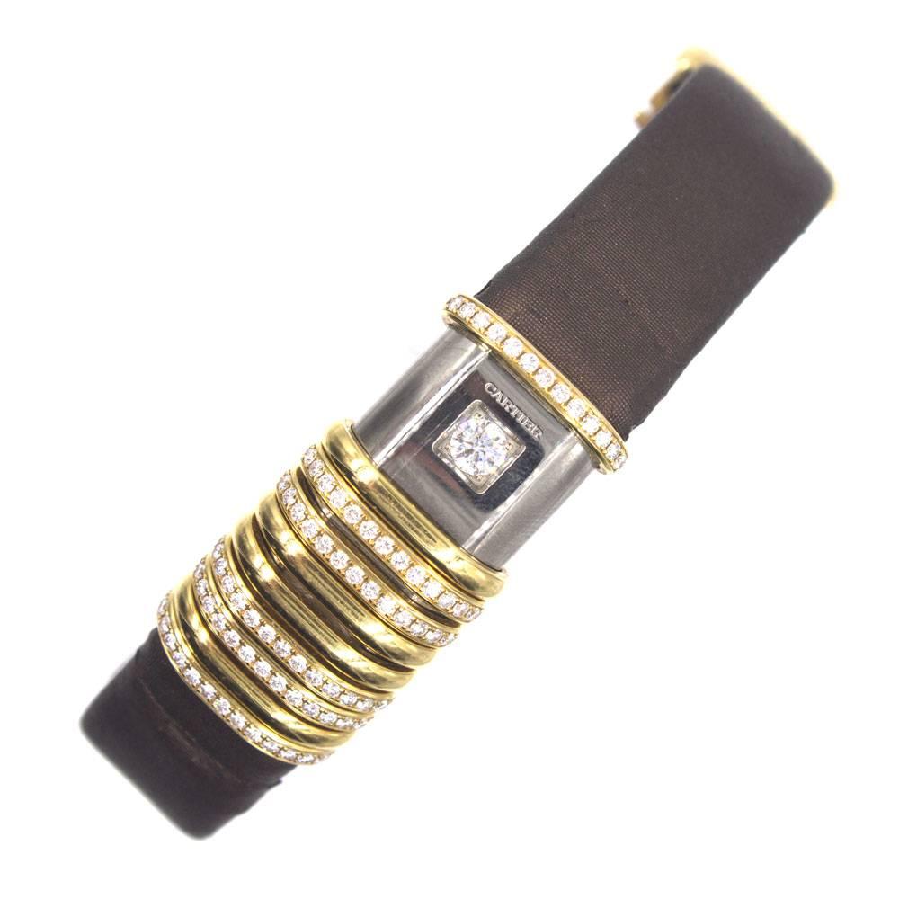 Cartier Declaration Diamond Watch is fashioned in 18 karat yellow gold. This is not only a high end time piece, but also a very nice fashion item due to all the diamonds shown throughout. This very rare model has diamonds that are moving on your