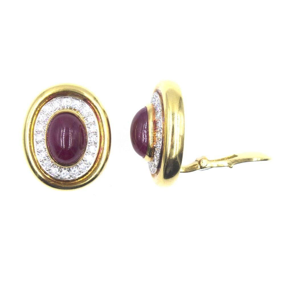 Beautiful vintage Webb diamond cabochon ruby earrings. The earclips are fashioned in 18 karat yellow gold and platinum. Approximately 1.00 carat total weight of diamonds surround the cabochon rubies. Each ruby is approximately 3-4 carats. 
