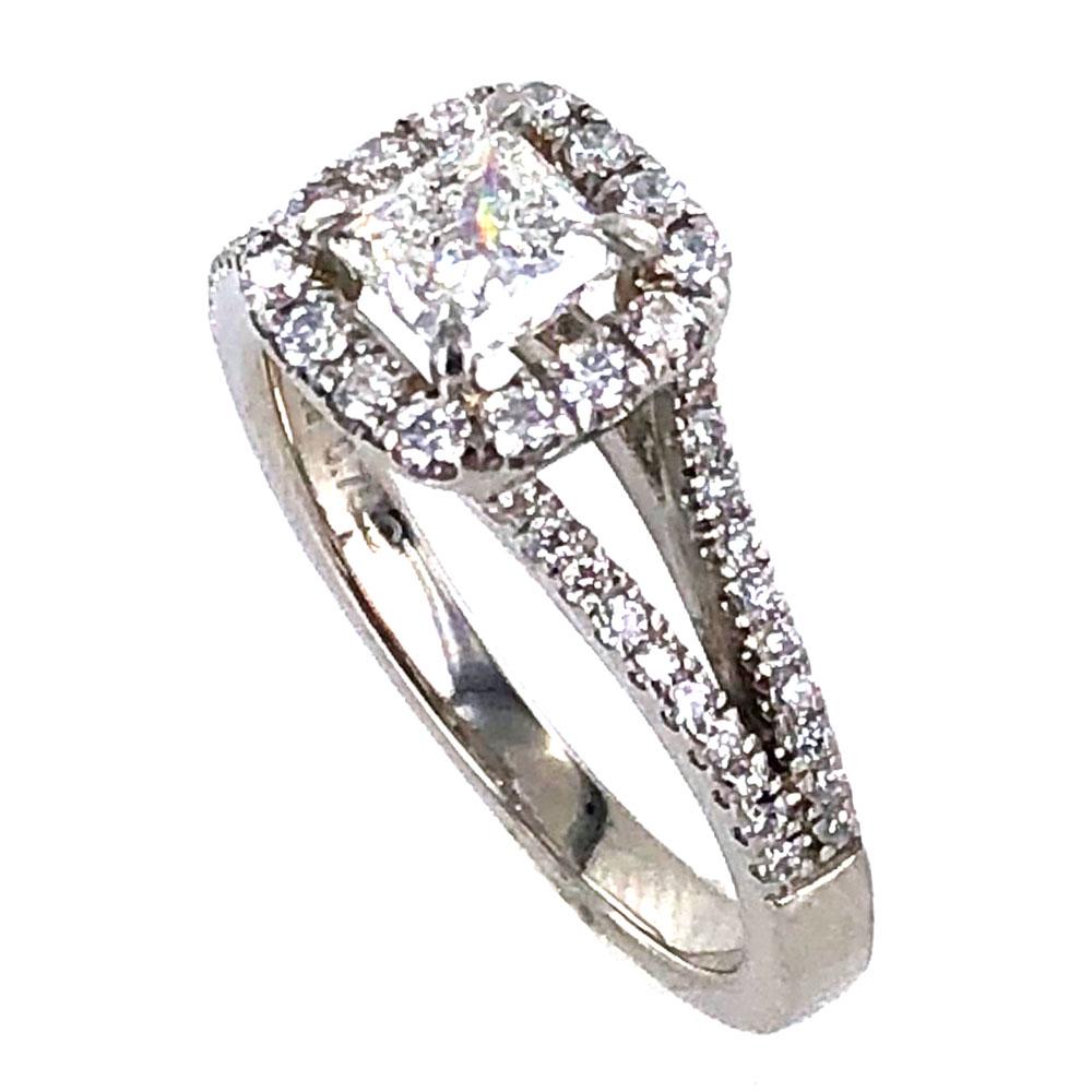 Modern princess cut diamond engagment ring fashioned in platinum. The center .70  carat princess cut diamond is graded H color and VS1 clarity by the GIA. The halo mounting features a split shank another .40 carat total weight of diamonds. The ring