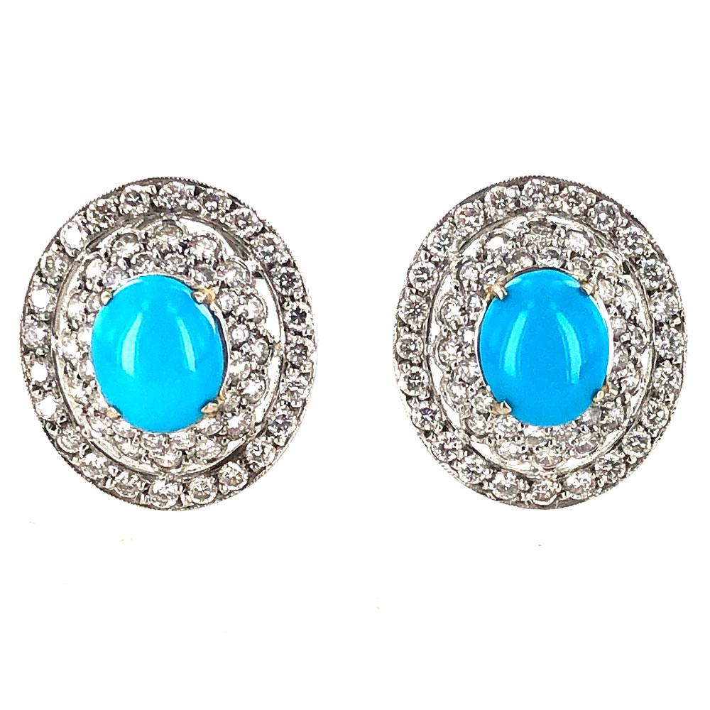 Stunning diamond and turquoise earrings fashioned in platinum. Persian Turquoise gemstones are surrounded by 2.50 carat of round brilliant cut diamonds. The diamonds are graded G-H color and SI clarity. The earrings measure 18 x 21mm, and feature