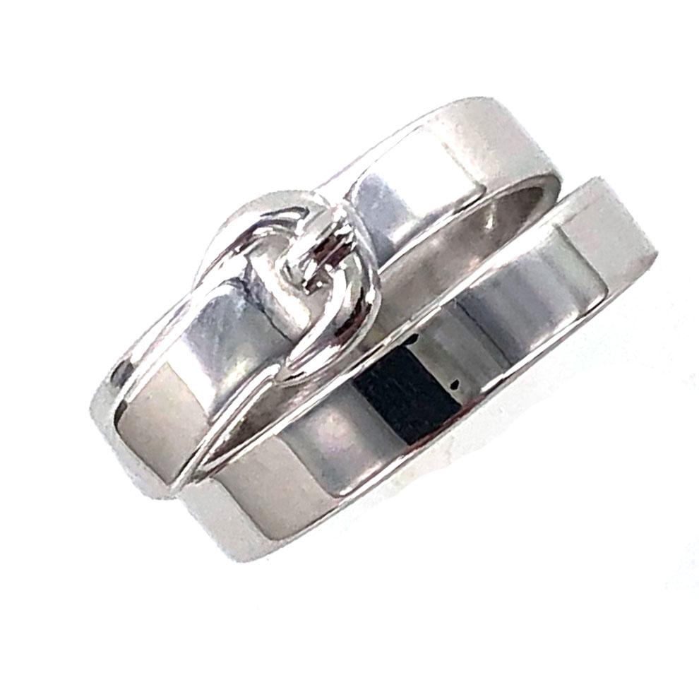 Stylish Hermes double buckle ring. The 18 karat white gold buckle ring measures 10mm in width and is size 54 (6.75). The ring is signed Hermes 750 54 865....The ring comes in an Hermes box. 