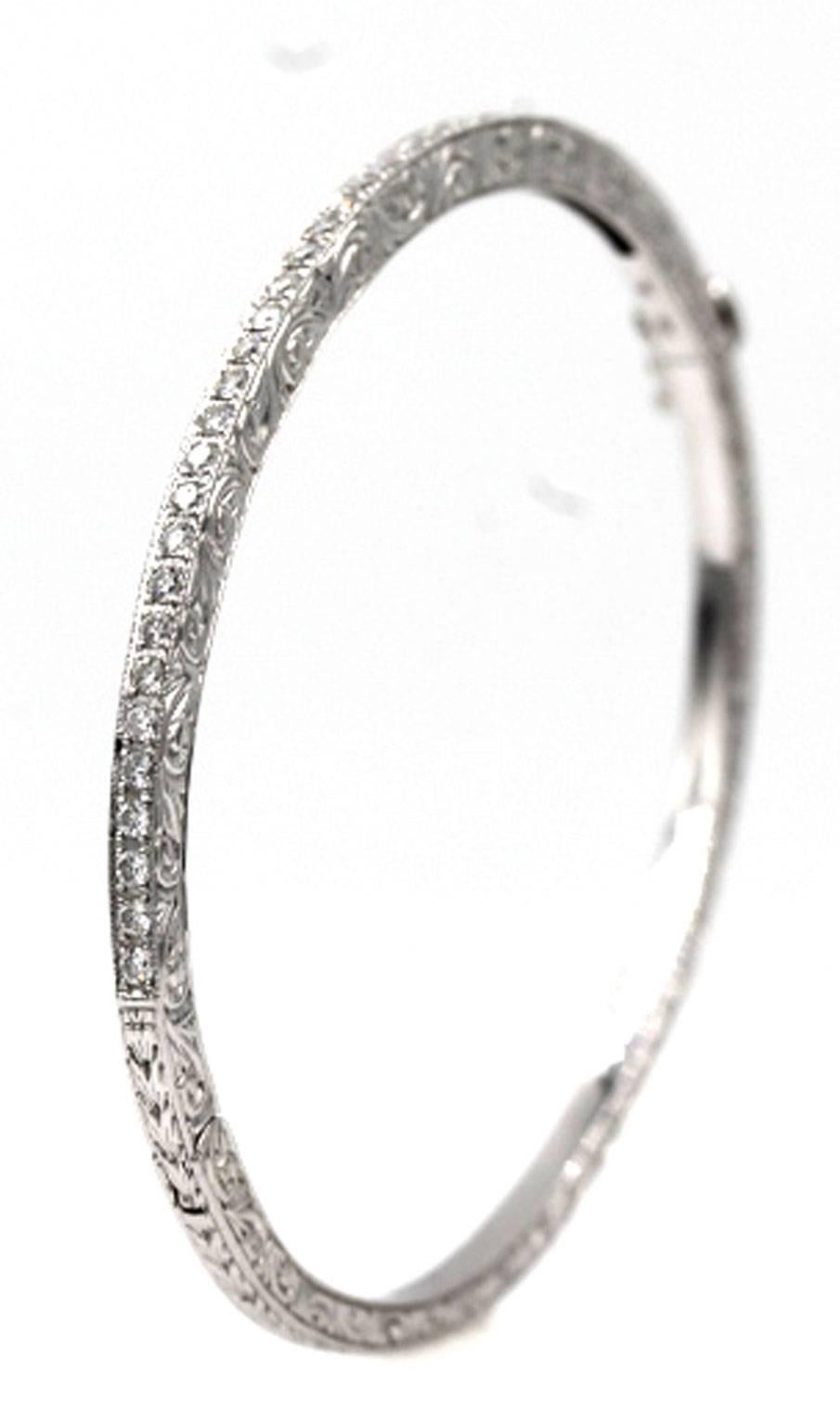 This stylish diamond bangle bracelet from designer Penny Preville can be worn with anything. The diamond bangle has beautiful etchings around each side, and has a diamond weight of approximately 1/3 carat. The bangle measures 7 inches, has a safety
