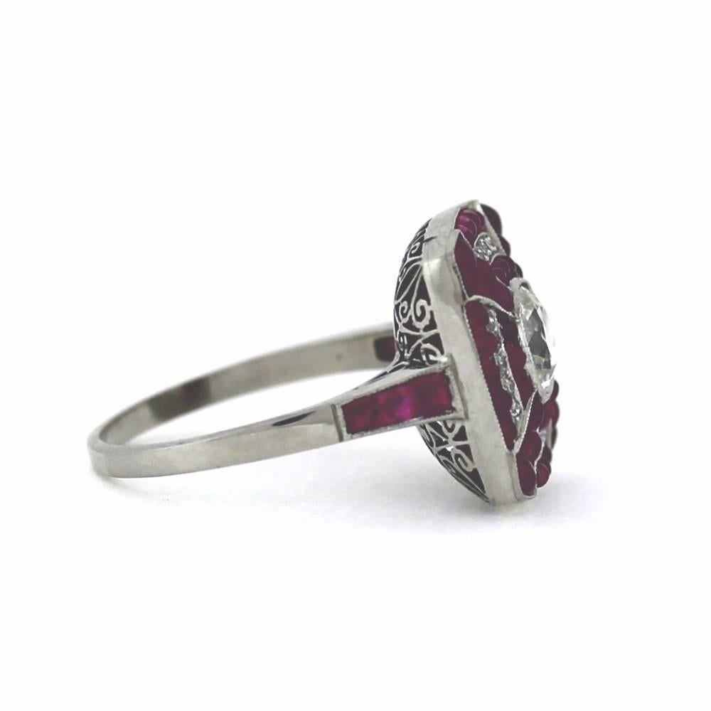 Magnificent Art Deco Style Diamond and Ruby ring... This ring is magnificently  made with incredible detail and features a .89ct old European cut diamond in the center...It is surrounded by square cut ruby's and approximately .20ctw of old European