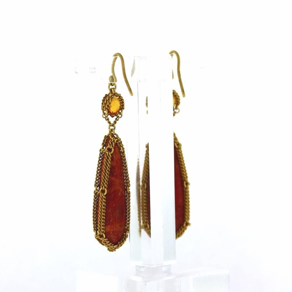 Large Agate briolettes below Citrine briolettes wrapped in a custom link chain woven around make these earrings so simple, yet so elegant.  The are a fine creation for the famous jewelry designer Anthony Nak.  Enjoy these beauties!