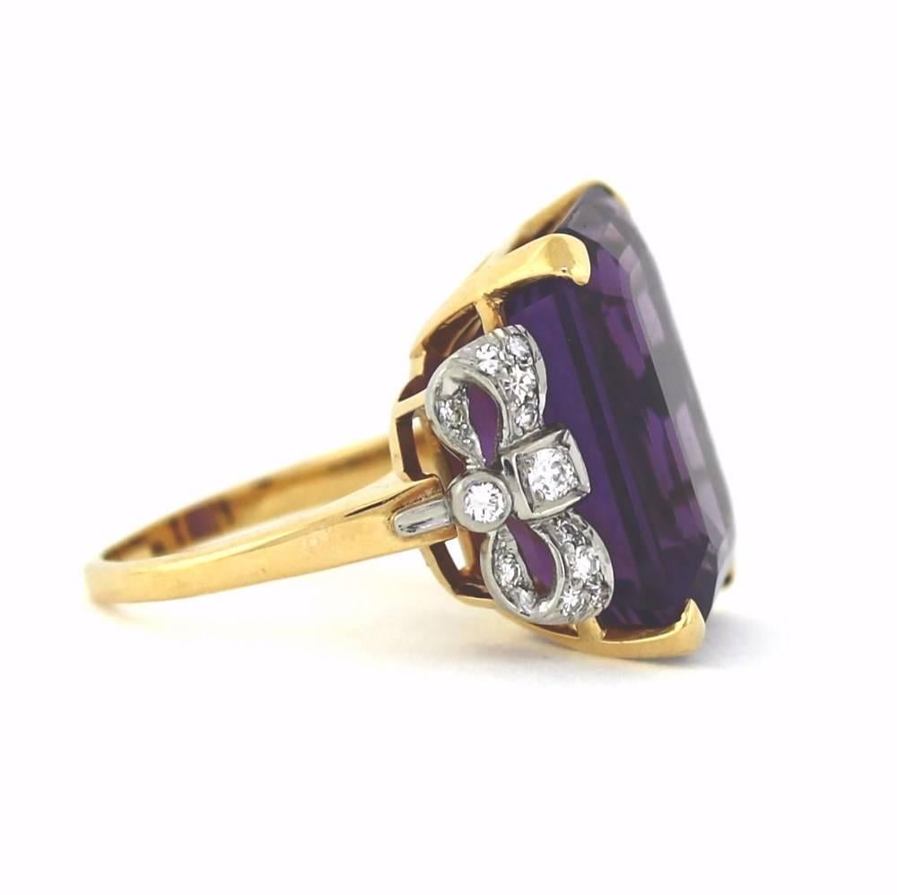 1940's Rosey Gold with a large estimated 30ct Purple Amethyst flanked with Diamond bows set in Platinum(about .50tcw)

Size 6.5, sizeable
