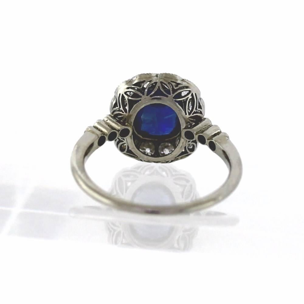 1.25ct Antique Sapphire with apprix. .90tcw old European cut diamonds set in a handmade platinum engraved and milgrain ring.  Amazing Craftsmanship!  Size 6.75, sizeable.