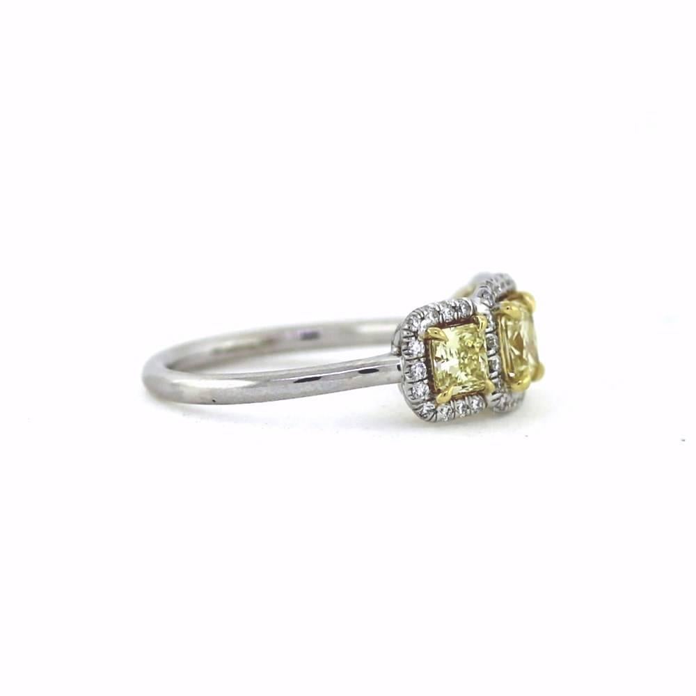 Perfect and Classic.  Center Yellow Cushion weighs .56ct, 2 two side Yellow Radiants weigh .61tcw & 42 round brilliant white diamonds weigh .23tcw.

All 3 yellow diamonds are set in a 18K Yellow gold cups to enhance their beauty while the rest of