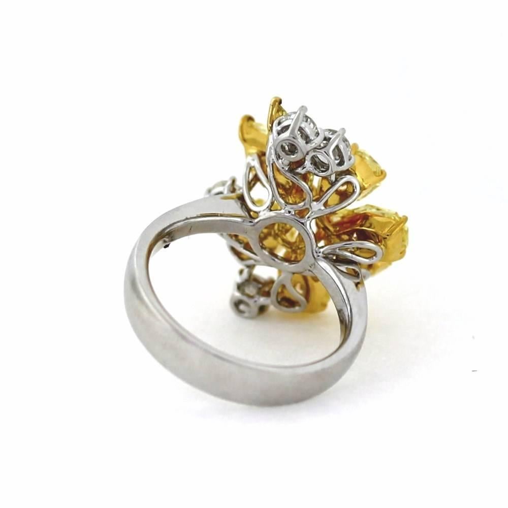 We love this ring partly because the diamond colors and shapes are so unusual and vibrant, but mainly because it is Gorgeous.  The ring includes a layout of seven fancy intense yellow shield like diamonds weighing 3.84tcw and 4 whites weighing