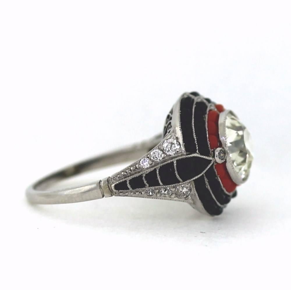 Hand made platinum with buff top black onyx and red coral made in the Art Deco fashion of the 1920's & 30's.  The center old european cut weighs 2.35ct and the 12 old euro side diamonds are .24tcw.  Size 7.5, sizable.