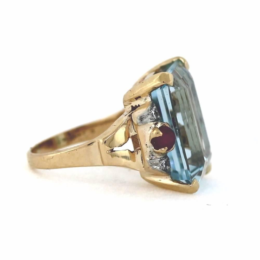 Classic Retro Aquamarine Ring. Platinum on 14K Rose Gold circa 1940.

13.01ct Aquamarine Beryl
0.12tcw Diamonds
2 Ruby cabs

size 4.5, sizable