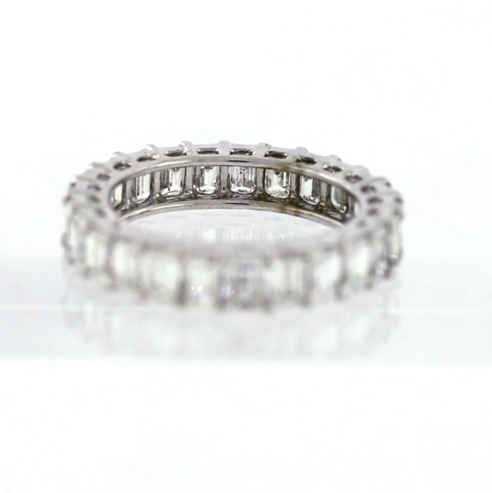 Hand Finished Eternity Band made in Platinum.  The band contains 25 Emerald Cut diamonds weighing a total of 3.80 carats.  On average, each diamond weights approximately .15ct.  The diamonds are G-H color (near colorless) and VS clarity.  This band