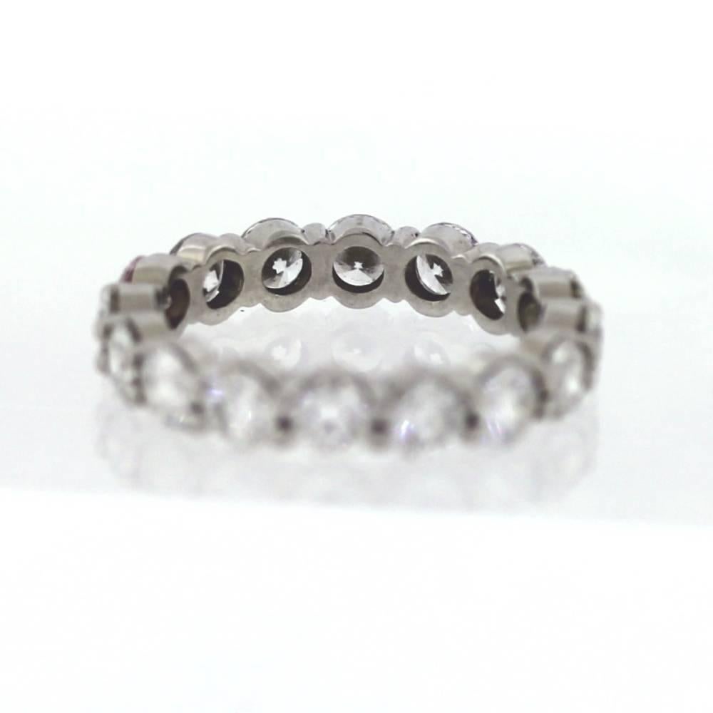 Hand Finished Eternity Band made in Platinum. The band contains 16 round brilliant cut diamonds weighing a total of 4.00 carats. On average, each diamond weights approximately .25ct. The diamonds are G-H color (near colorless) and VS clarity. This