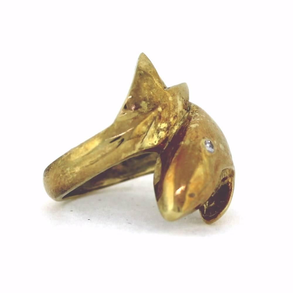 A neat and unique 14k yellow gold shark ring.  Designed by Maurice Katz and contains a diamond as the shark eye. This ring is sizable to any size.