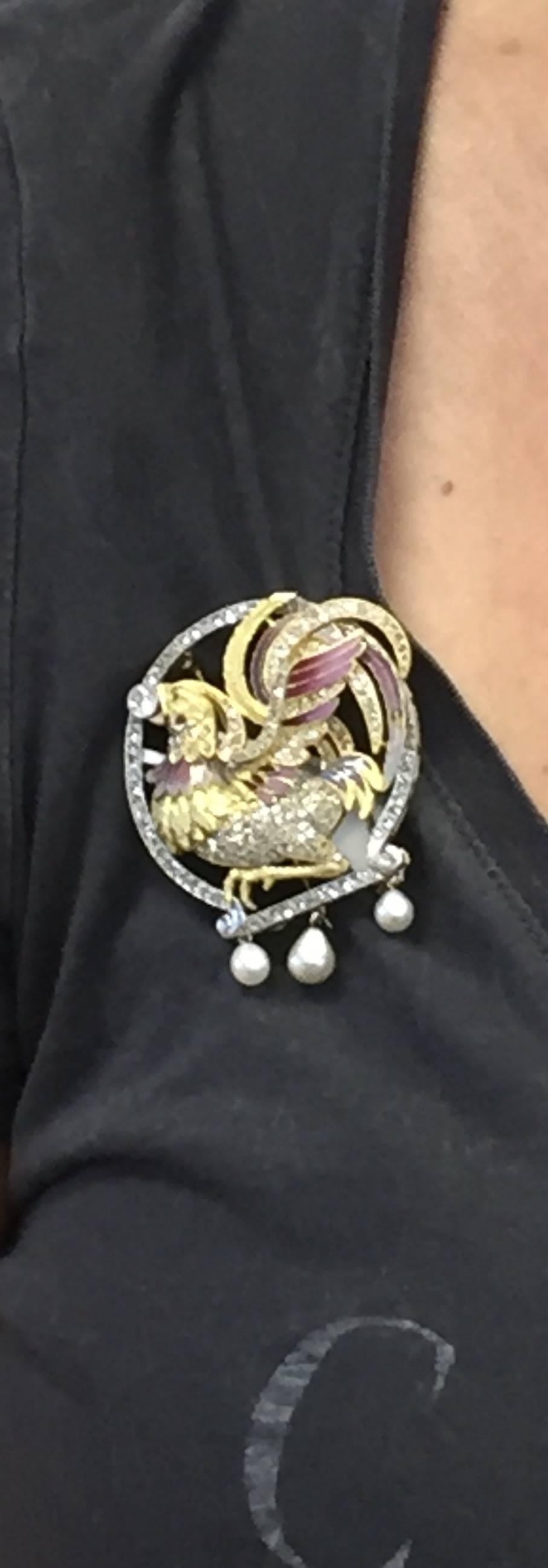 Magnificent Antique Rooster Brooch made of platinum.  Consists approximately 2.50ctw of diamonds, finely done purplish pink enamel, 18k yellow gold, and 3 pearls.  Beautiful look!