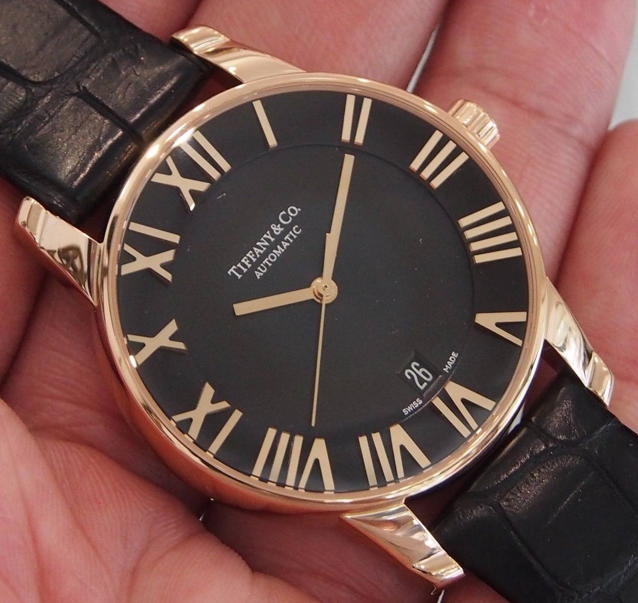 Brand Name  Tiffany & Co.   
Style Number  Z1800.68.30A10A70A  
Also Called  Z18006830A10A70A  
Series  Atlas Dome  
Gender  Men's  
Case Material  18K Rose Gold  
Dial Color  Black  
Movement  Automatic  
Functions  Hours, Minutes, Seconds,