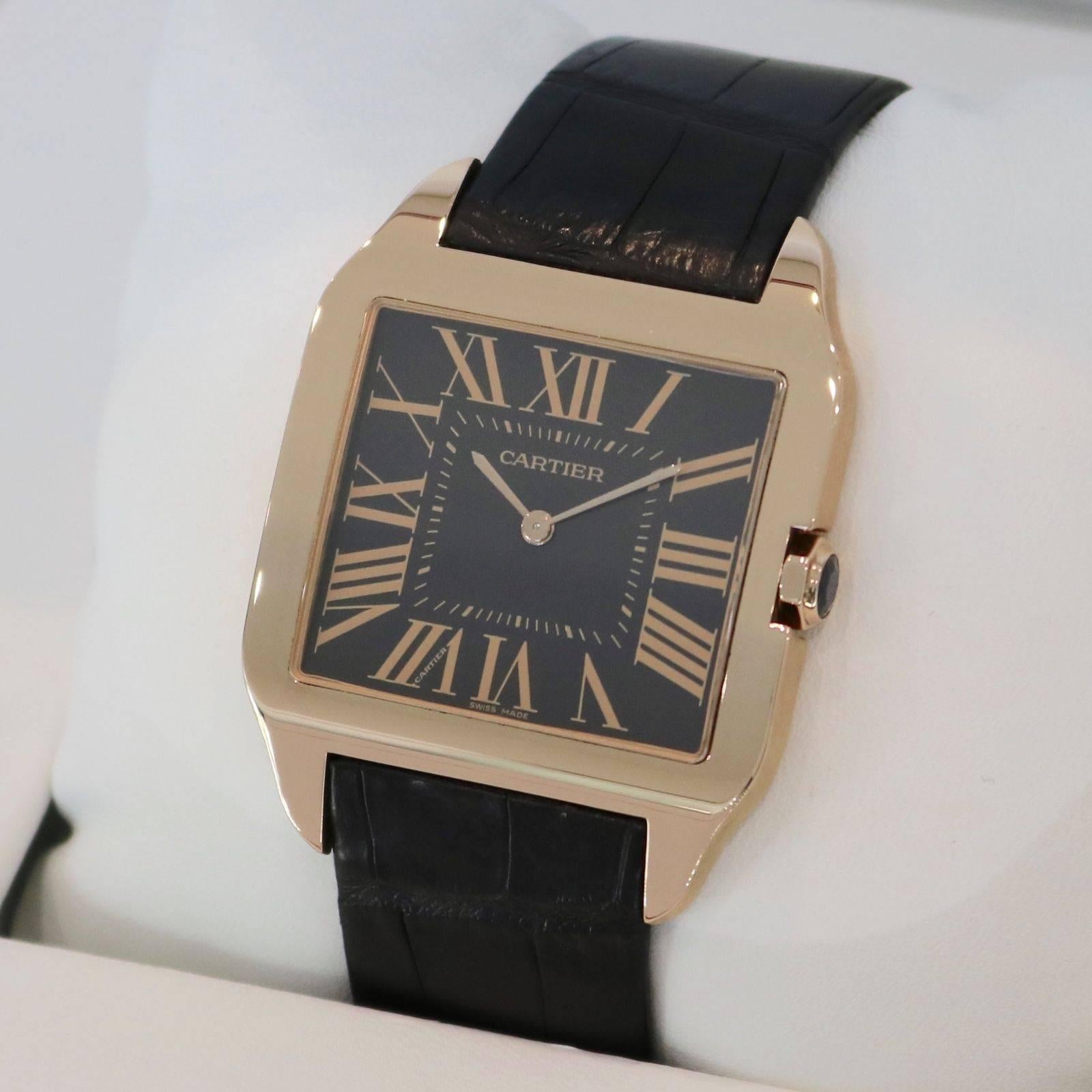 Brand Name:  Cartier
Style Number:  W2012851
Series:  Santos Dumont Large
Gender:  Men's
Case Material:  18k Rose Gold
Dial Color:  Chocolate Brown
Movement:  Hand Wind
Engine:  Cal. 430 MC
Functions:  Hours, Minutes
Crystal Material:  Sapphire
Case