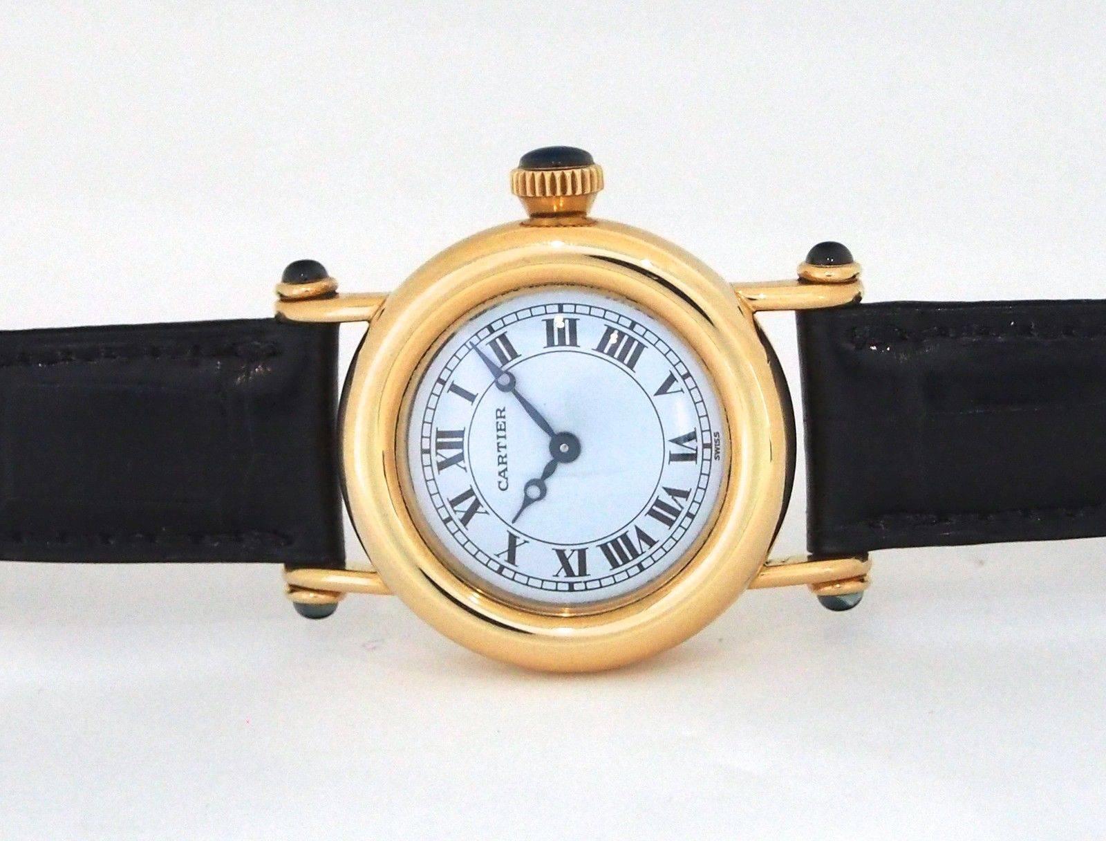 Brand Name:  Cartier
Style Number:  Ref. 1440
Also Called:  Diabolo
Series:  Diablo
Gender:  Lady's
Case Material:  18K Yellow Gold 
Dial Color:  White
Movement:  Quartz
Functions:  Hours, Minutes
Crystal Material:  Sapphire
Case Diameter: 