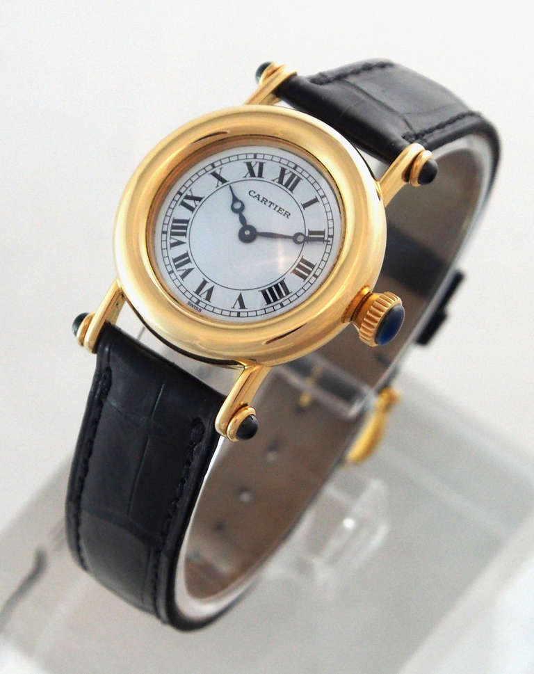 Brand: Cartier
Ref.: 1440
Model: Diablo
Gender: Ladies
Case Material: 18K Yellow Gold
Dial Color: White with Roman Numerals
Movement: Quartz
Crystal Material: Scratch Resistant Sapphire
Case Diameter: 27mm
Crown: 18K Yellow Gold with