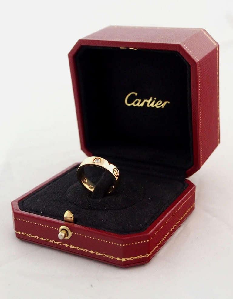 Brand Name: Cartier

Style Number: B4032400

Series: Love

Gender: Unisex

Material: Yellow Gold

Stones: 3 Diamonds

European Size: 55

U.S. Size: 7