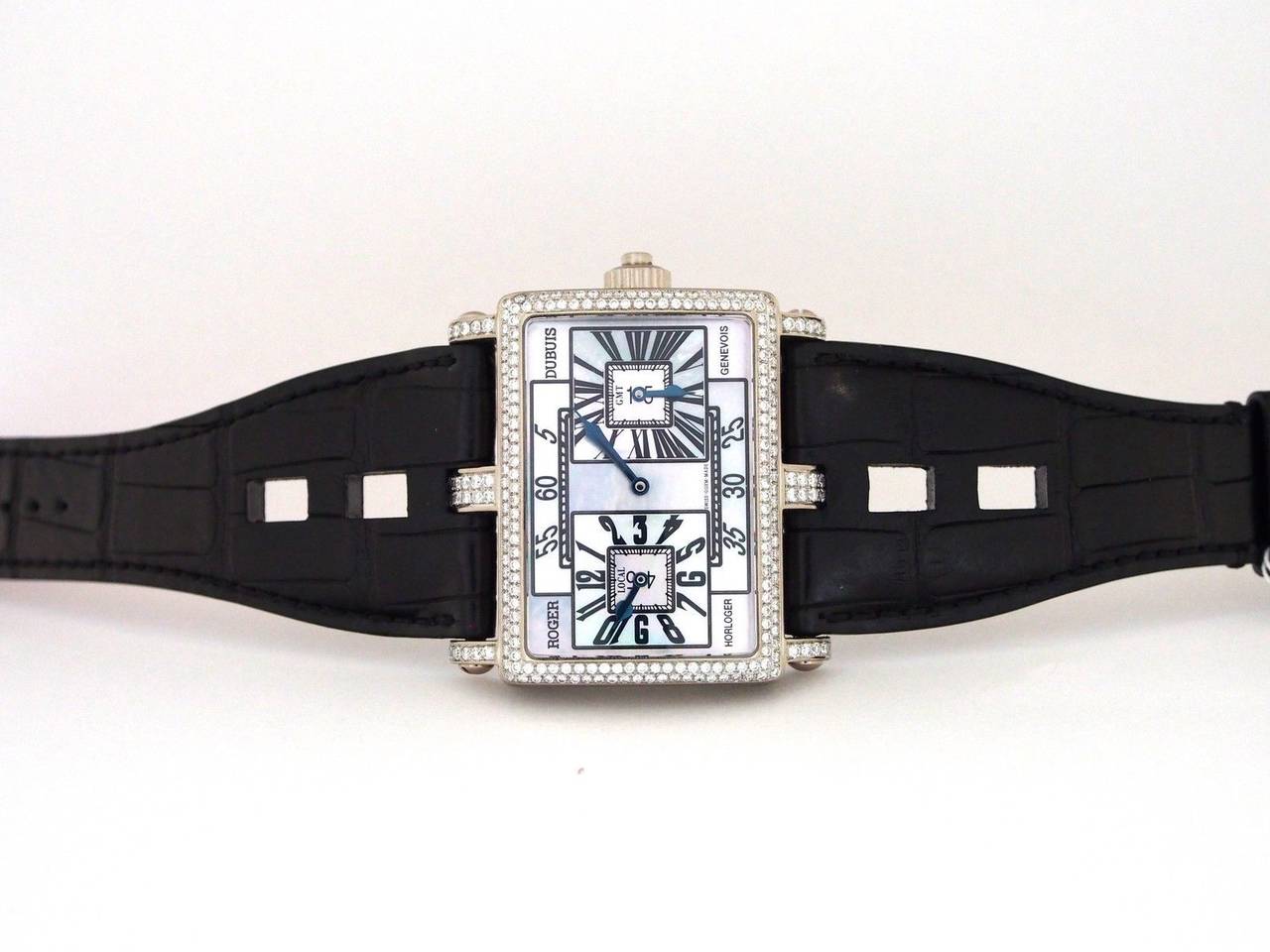 Brand Name  Roger Dubuis  
Style Number  T319847056.37  
Also Called  T31 9847 0 56.37  
Series  Too Much GMT Bi-retrograde  
Gender  Gents  
Case Material  18k White Gold w/ Diamonds  
Dial Color  Mother of Pearl  
Movement  Manual Wind 