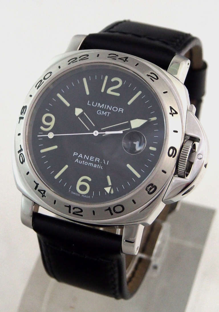 Brand:	 Panerai
Style Number:	 PAM 23
Circa: 1998
Series:	 Luminor GMT (Contemporary Series), A Series
Case Material:	 High Polish Stainless Steel
Dial Color:	 Black with Applied Tritium Markers
Movement:	 Automatic, ETA 2893/2
Functions:	