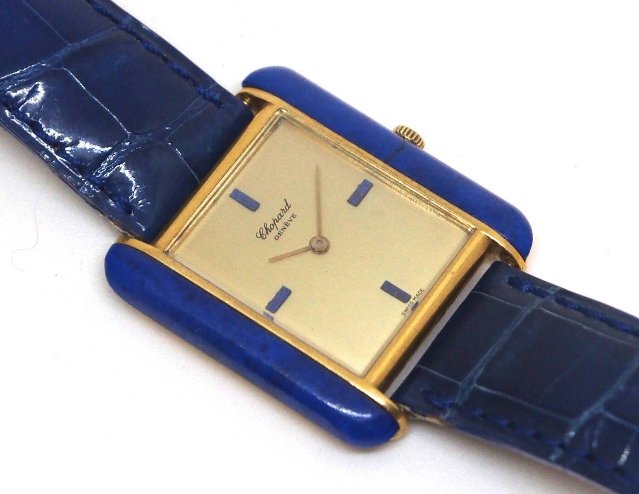 Brand Name:	Chopard
Ref. Number:	2021-1
Case Material:	18K Yellow Gold
Dial Color	: Gilt with Blue Hour Markers
Movement:	Manual-Wind, 17 Jewel
Case Diameter:	30mm x 33mm