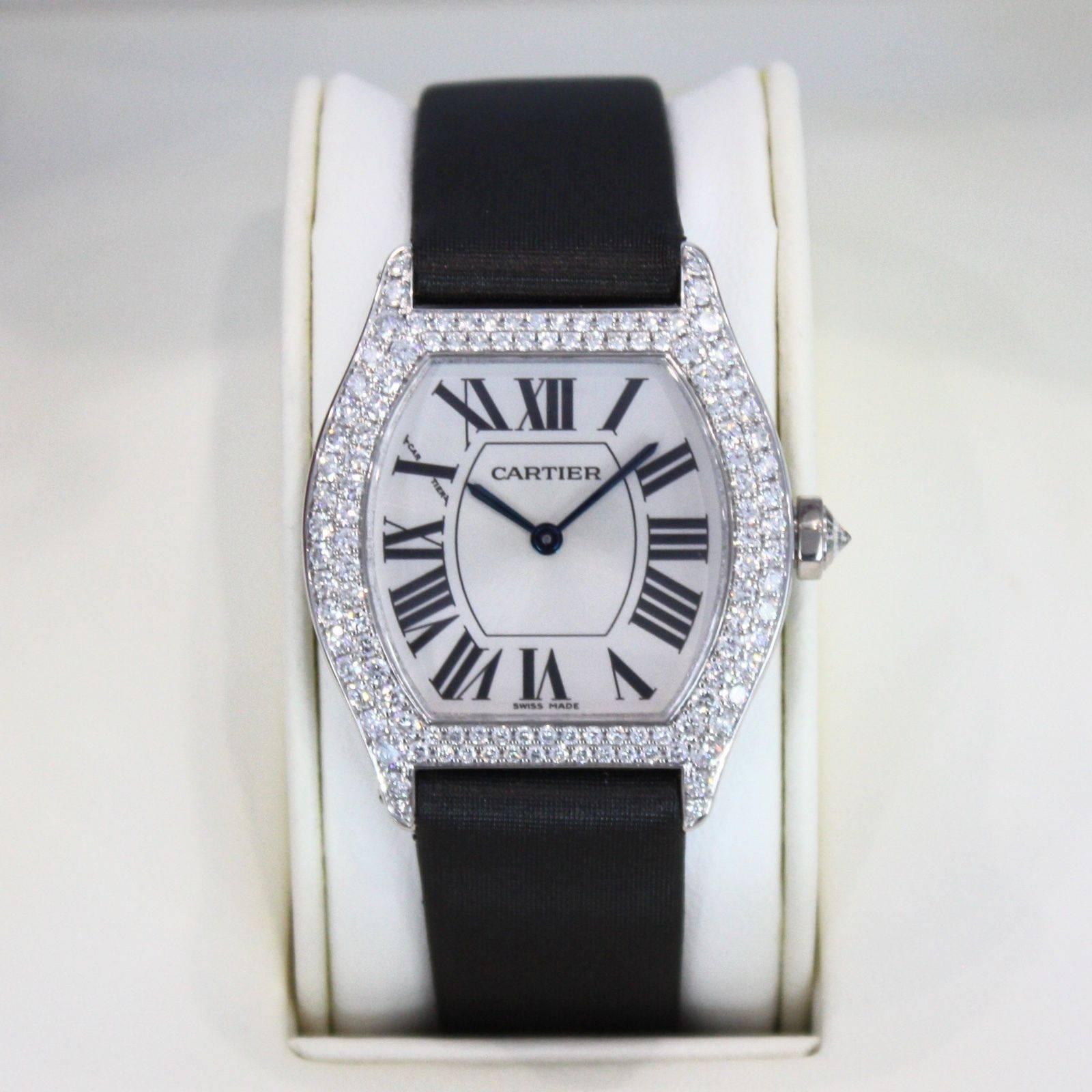 Brand Name: Cartier
Style Number: 2644
Series: Tortue Collection de Privee
Gender: Lady's
Case Material: 18k White Gold w/ Diamonds
Dial Color	: Silver Guilloche w/ Roman 
Movement: Mechanical Wind
Engine: Cal. 430
Functions: Hours, Minutes
Crystal