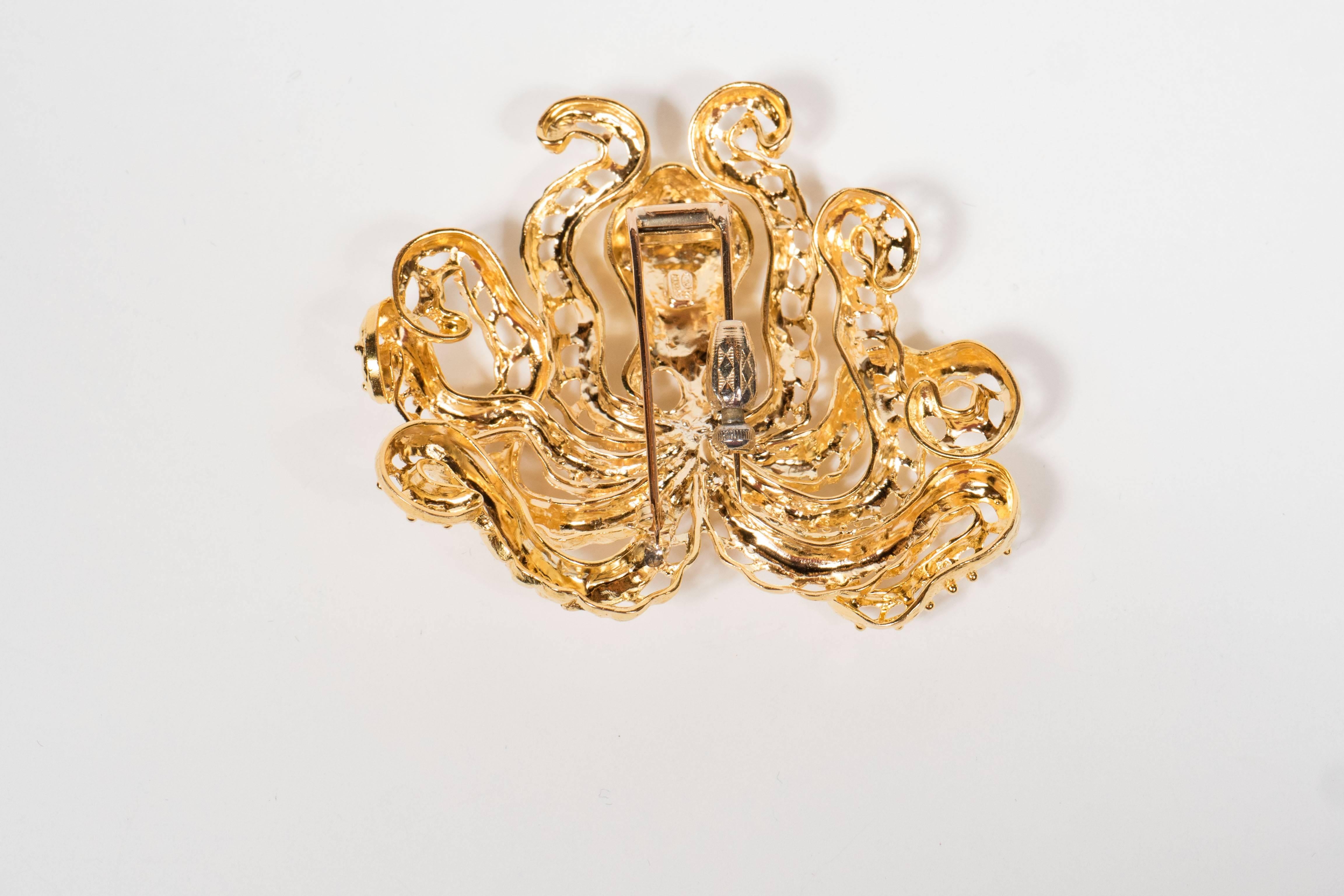 This incredible brooch features a modernist octopus design all executed in 18 k yellow gold. It can also be worn as a pendant as well .It is marked 18k Greece and weighs 52 grams.
