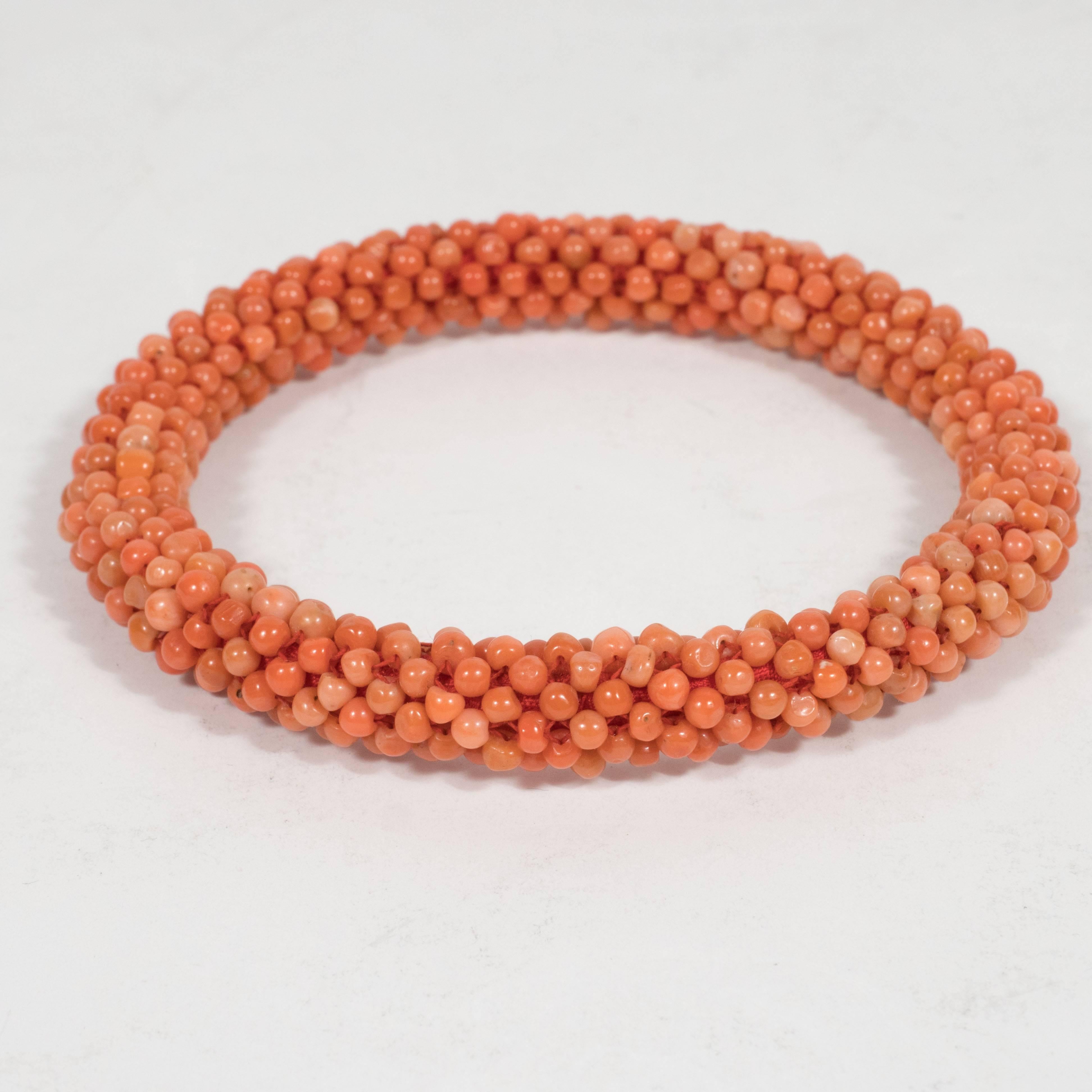 This magnificent bracelet showcases the intrinsic beauty of the precious red coral with an abundance of hand polished beads relating the natural color variation of the material. Red coral has been appreciated by humanity since time immemorial. It
