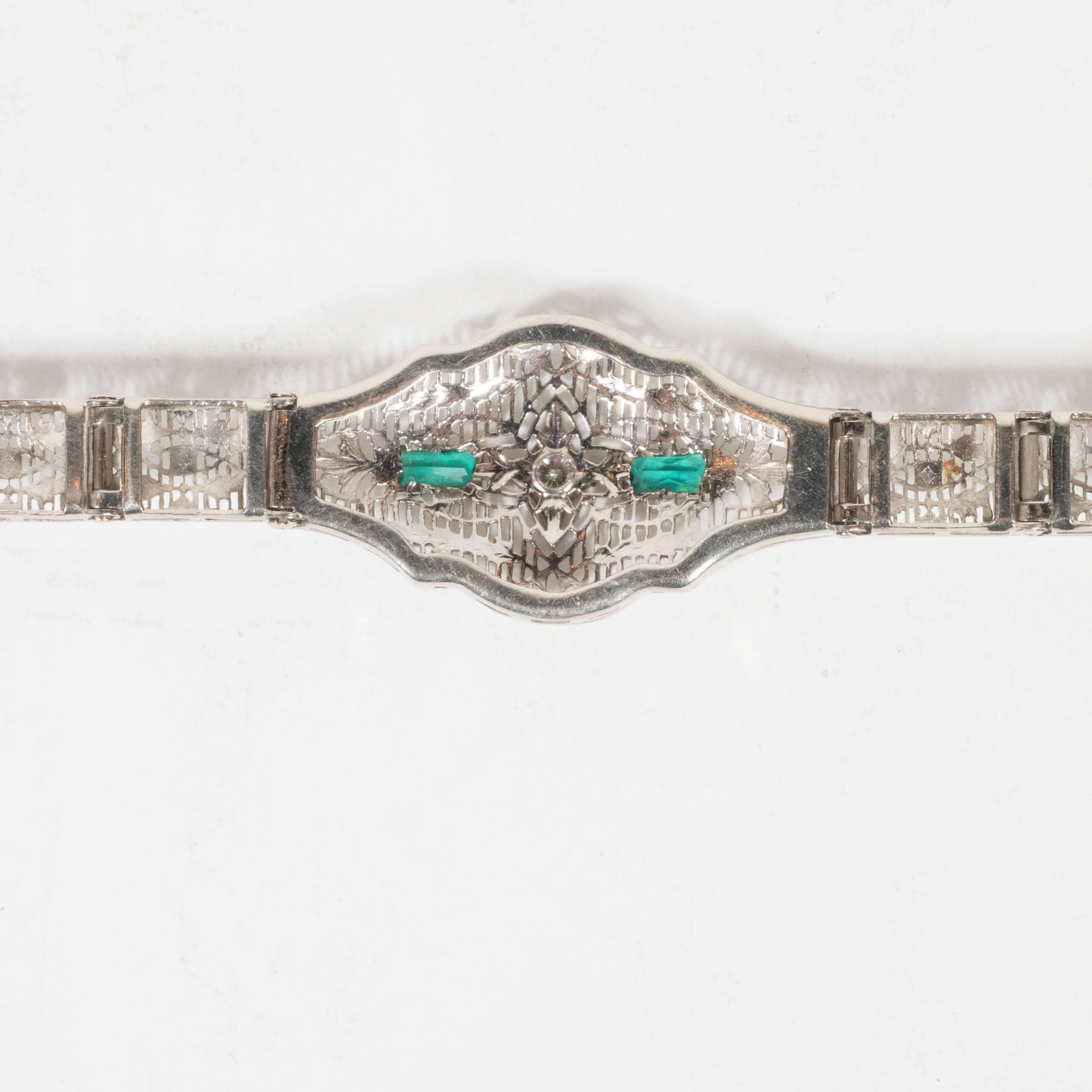 Elegant Art Deco White Gold and Emerald Bracelet with Stylized Foliate Motifs In Excellent Condition In New York, NY