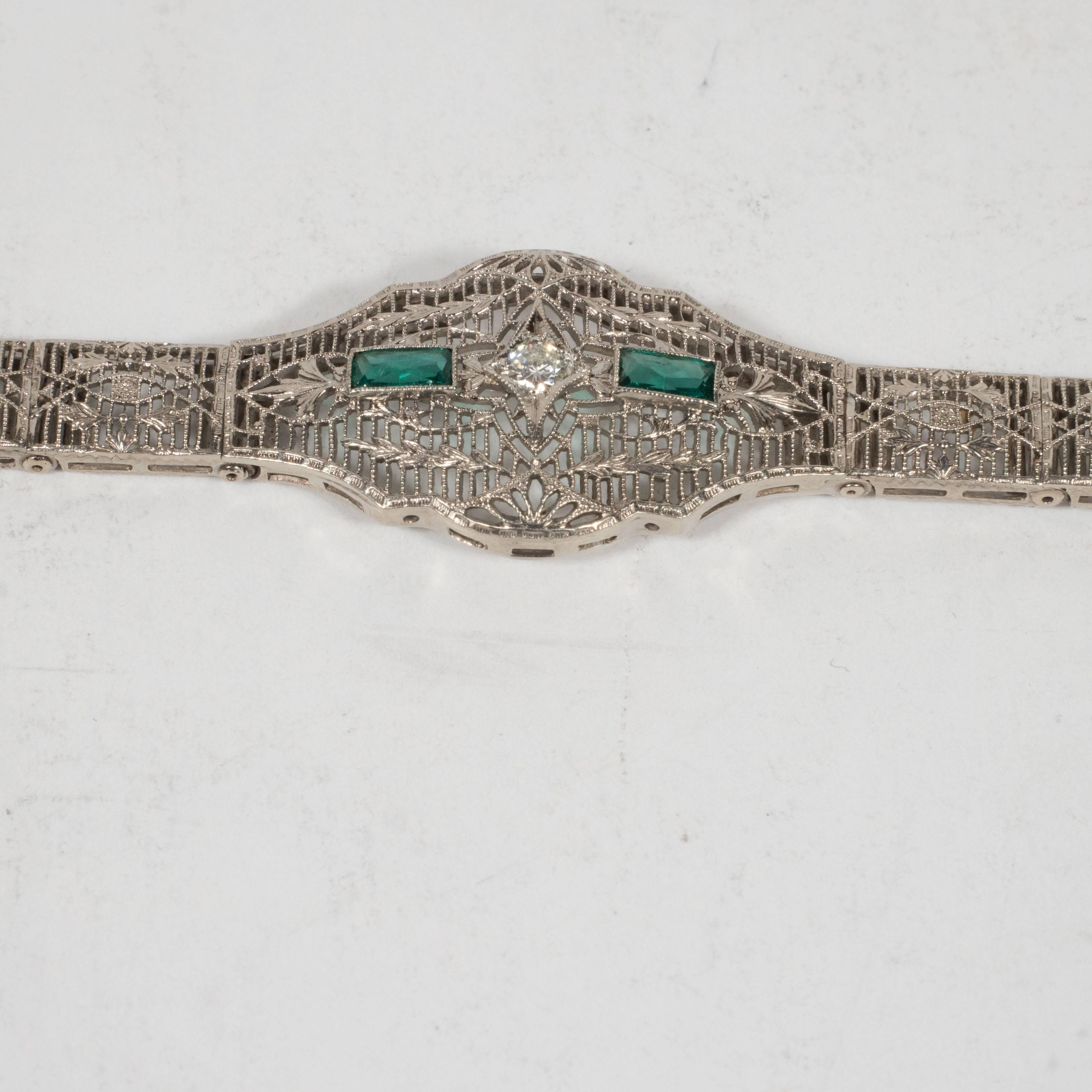 Elegant Art Deco White Gold and Emerald Bracelet with Stylized Foliate Motifs 1