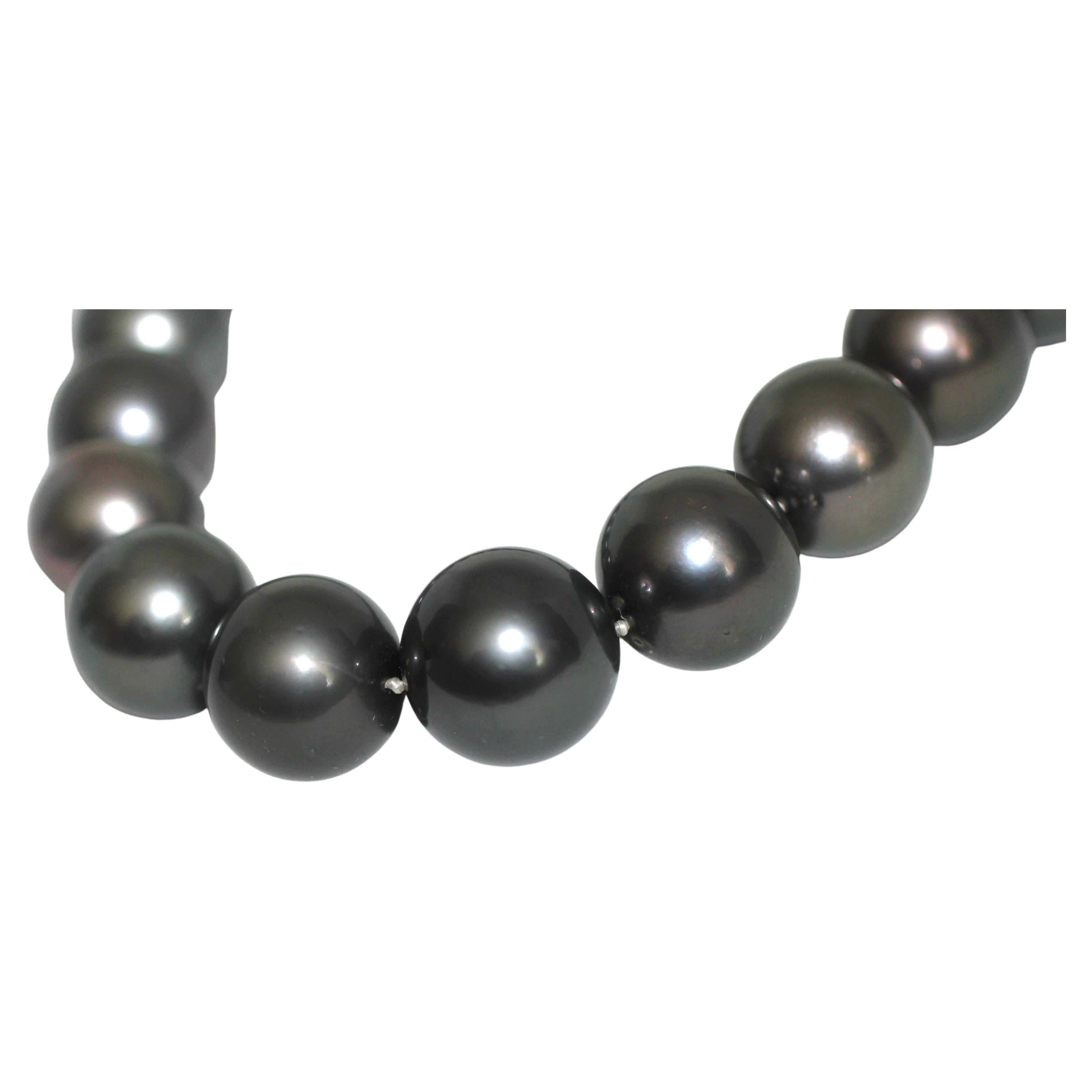 Hakimoto By Jewel Of Ocean 15-16.7mm Black Round Tahitian Cultured Pearls
18K High Polish White Gold Featuring 12 mm full ball Round Near Colorless Brilliant Diamonds clasp
Total Weight (g): 142.4
Orient: Present
Luster: Very Good
Surface: Lightly