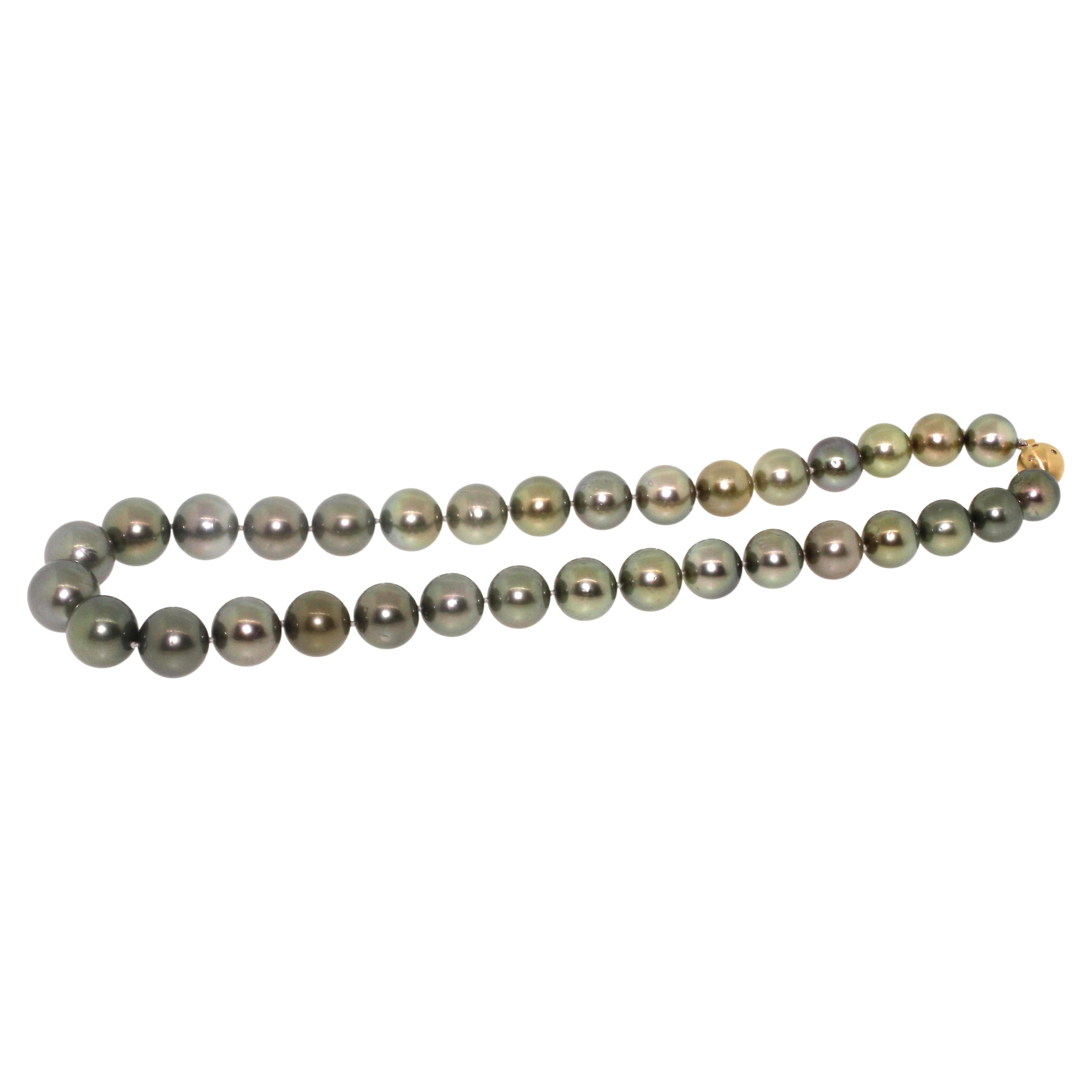 Hakimoto By Jewel Of Ocean Tahitian South Sea Pearl Necklace
33 High Luster with Green Tone 11x13.7mm Tahitian Pearls 
18K Yellow Gold with Diamonds Clasp
17.5