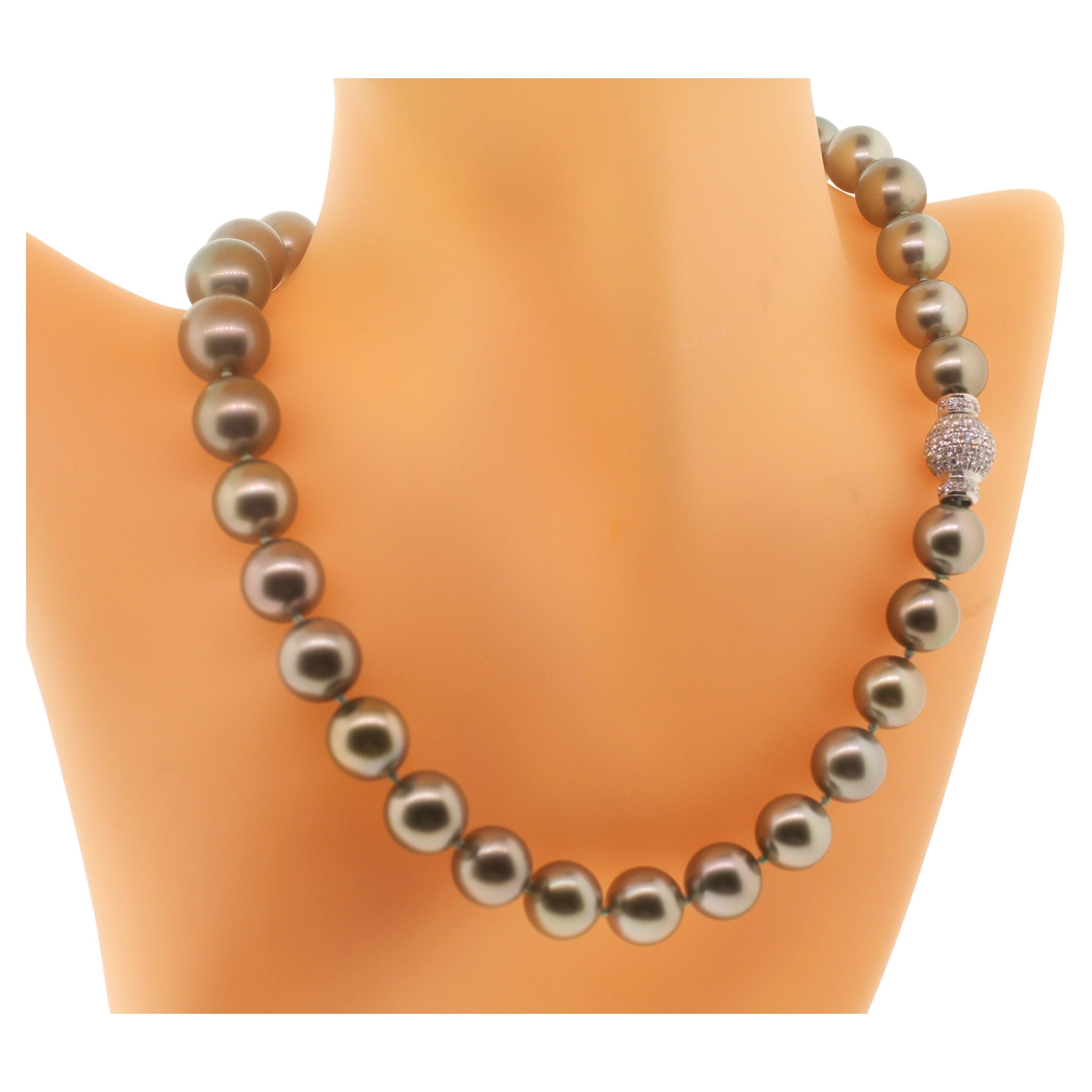 Hakimoto By Jewel Of Ocean 18K South Sea Strand Necklace
18K White Gold  Full Diamonds Clasp
Weight (g): 76
Cultured Tahitian South Sea Pearl 
Pearl Size: 12X10 mm 
Pearl Shape: Round 
Body color: Pistachio
Orient: Very Good
Luster: Very