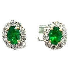 Emerald and Diamond Halo Earrings in 18KW Gold