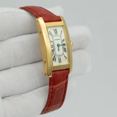 Reloj de mujer Cartier Tank Americaine W2601556, con correa de piel, oro amarillo de 18 quilates y esfera plateada