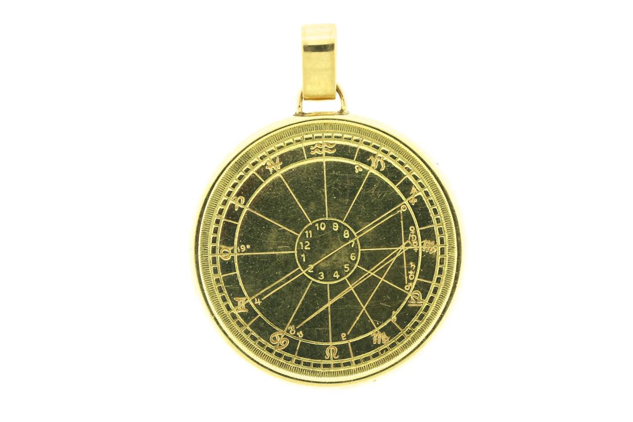 Cartier 18k gold unusual astrological pendant bearing all the signs of the zodiac. 1.5