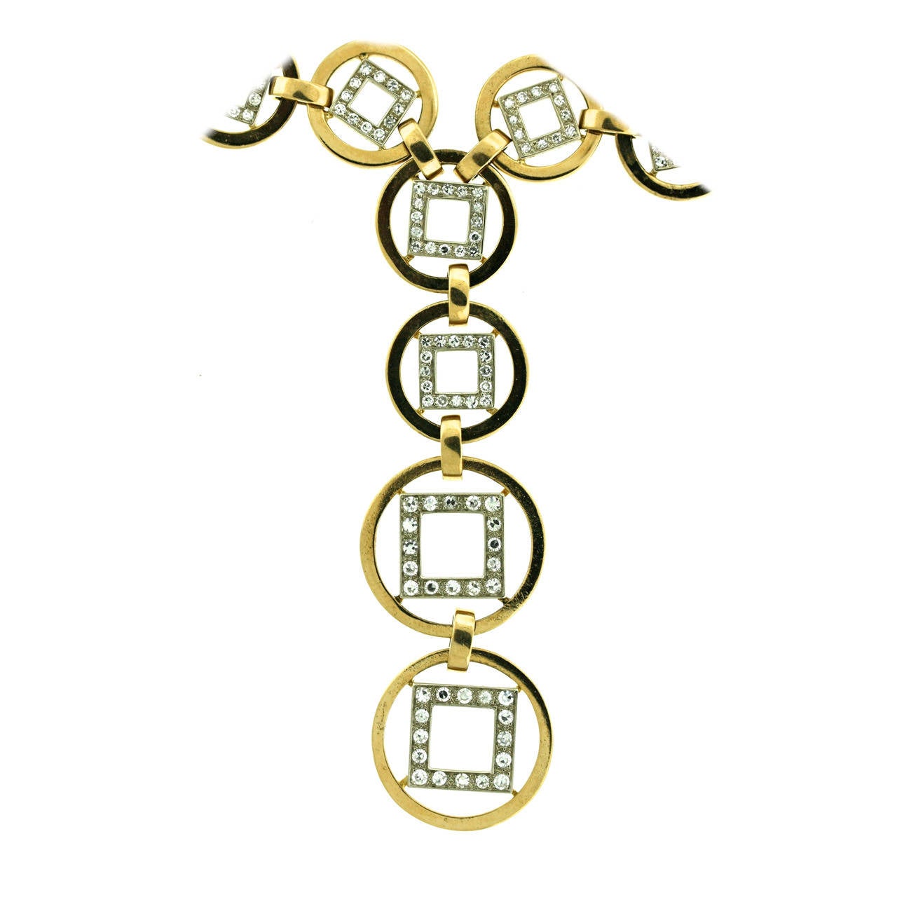 Faraone 1970s18k polished gold and diamond sautoir designed as a series of circular links each centering an interior white gold diamond set square. Each link rotates independently so that the diamond squares tilt at will and shift periodically