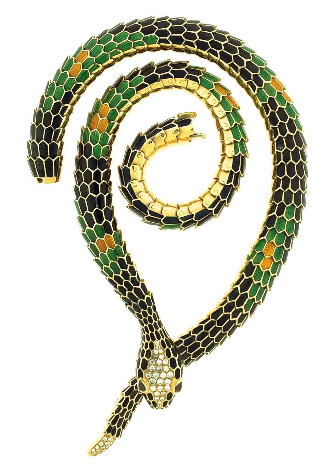 A vibrant enamel and diamond serpent necklace by master jeweler Illario. The skillful Illario workshop made the all of the Bulgari Serpenti pieces in the 1960s and 70s. Emerald green, jet black and golden enamel scales offset a diamond set tail and