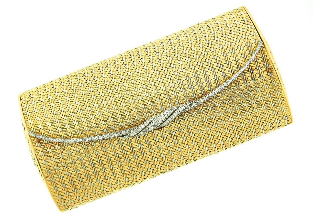 Chaumet Paris 18k yellow and white gold evening bag designed as a woven, rigid structure. The edge of the closure flap is embellished with 122 brilliant cut white diamonds set in platinum with an approximate total weight of 4 carats. Mint condition.