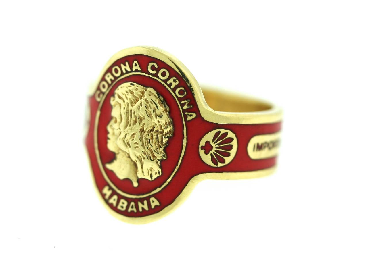Cartier 18k gold and red enamel ring designed in a cigar band motif. This is an iconic and collectible Cartier piece from 1974. Size 5.5. Signed Cartier and numbered.