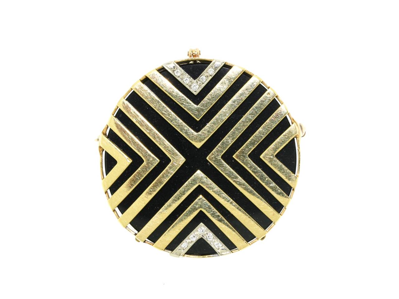 Van Cleef & Arpels 18k gold geometric pendant mounted on a circular disc of black onyx with diamond-set top and bottom embellishments suspended from a 15