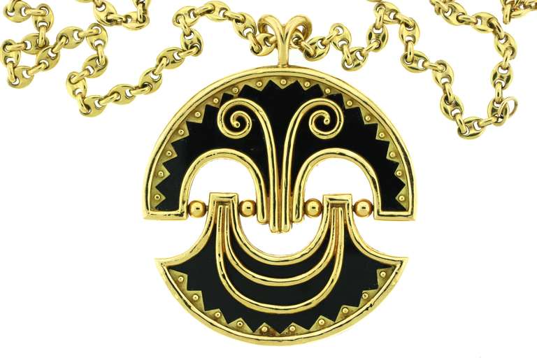 A spectacular articulated 18k gold  necklace suspending a large black onyx pendant of abstract design depicting a cheerful smiling face. The whimsy and personality of this piece is most exuberant and quite unusual.  As always, French craftsmanship