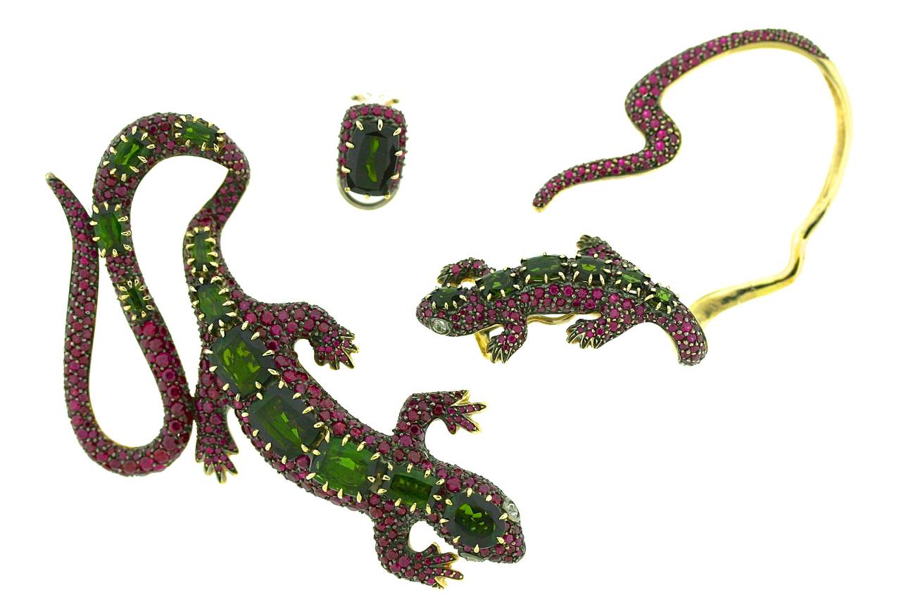 H. Stern 18k gold salamander brooch, ear cuff and single earring suite. Each piece is set with pink and green tourmalines and the brooch and ear cuff each have diamond eyes. Brooch measures 3.5