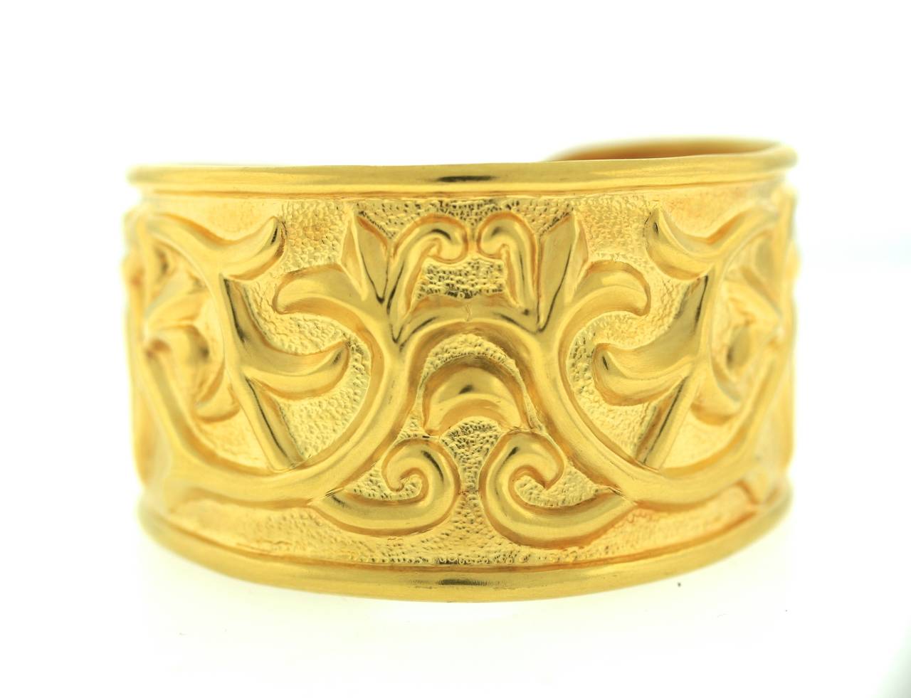 Ilias Lalaounis 18k gold cuff with repousse scrolling foliate pattern. Measures 1.5
