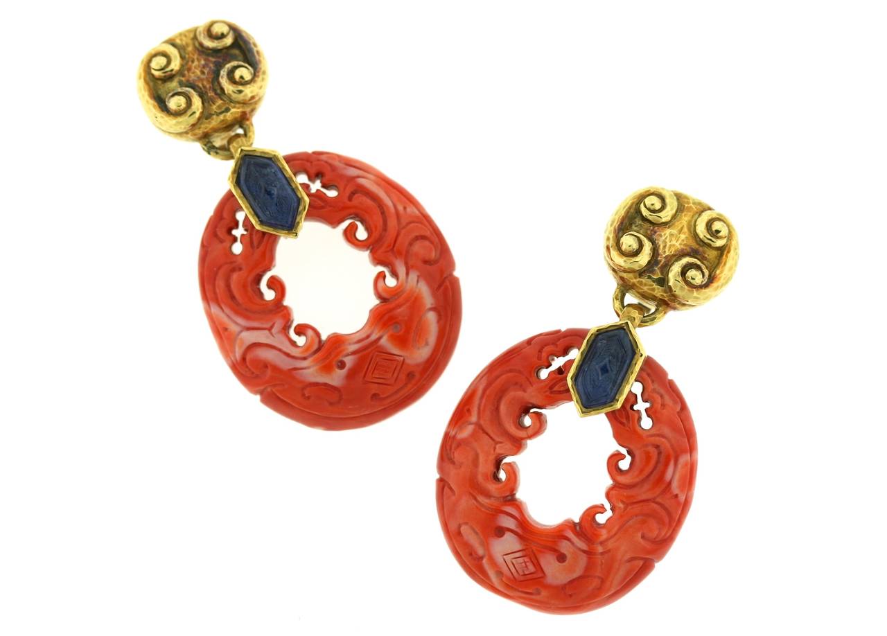 David Webb magnificent 18k hammered gold, coral, and sapphire ear clips with a square scrolled top suspending carved sapphires and large carved coral open oval shaped links. 3